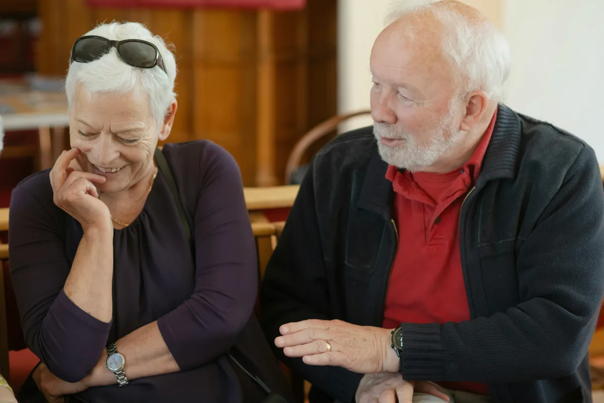 An adult child reviewing a relative's care home invoice, representing the question of whether next of kin are legally responsible for UK care home fees.