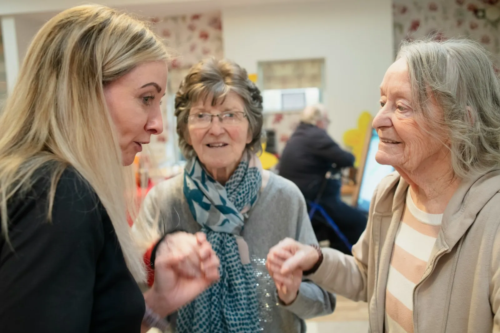 A family reviewing assessment paperwork and notes together — the practical work of preparing a Care Act challenge, often around the cumulative-effect sub-clause or the broader Section 1 wellbeing definition.