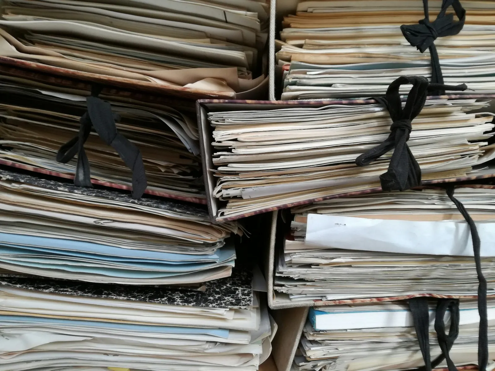 A desk with organised, tabbed and highlighted medical records arranged in chronological order — what an SAR response looks like once a family has begun mapping it to the 12 CHC care domains.